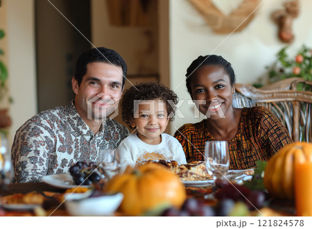 Family with child at the festive table at home, autumn holidays 121824578