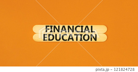 Financial education symbol. Concept words Financial education on beautiful wooden stick. Beautiful orange paper background. Business Financial education concept. Copy space. 121824728