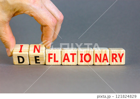 Deflationary or inflationary symbol. Concept words Deflationary Inflationary on wooden blocks. Beautiful grey background. Businessman hand. Business deflationary inflationary concept. Copy space Deflationary or inflationary symbol. Concept words Deflationary Inflationary on wooden blocks. Beautiful grey background. Businessman hand. Business deflationary inflationary concept. Copy space 121824829