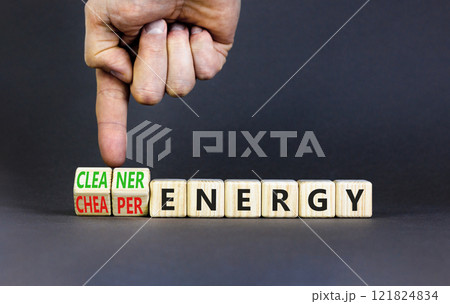Cleaner or cheaper energy symbol. Concept words Cleaner energy Cheaper energy on beautiful wooden blocks. Beautiful grey background. Business Cleaner or cheaper energy concept. Copy space. 121824834