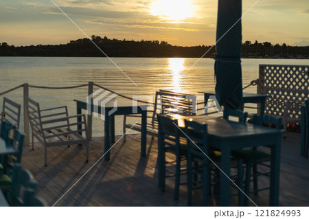 sunrise on the sea coast, cafe on the coast 121824993