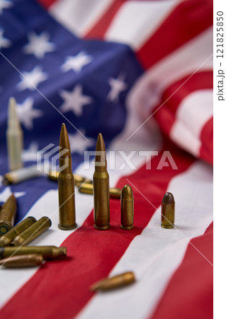 Different types of ammunition on top of flag of the United States. 121825850