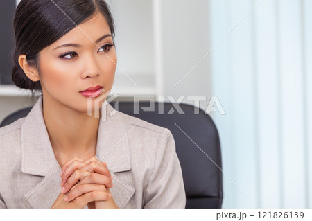 Asian Chinese Woman or Businesswoman in her Office 121826139