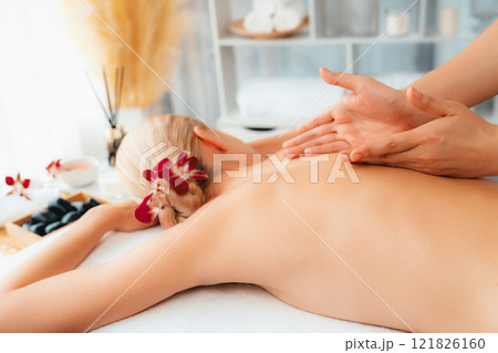 Closeup woman customer enjoying relaxing anti-stress massage. Quiescent 121826160