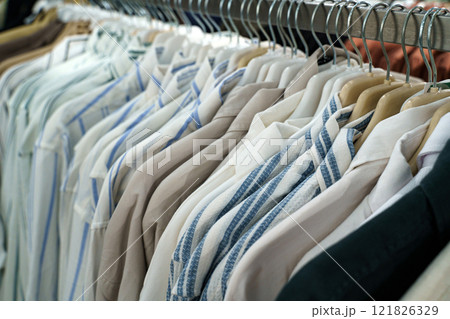 Stylish shirts on display in a vibrant clothing boutique Stylish shirts on display in a vibrant clothing boutique 121826329
