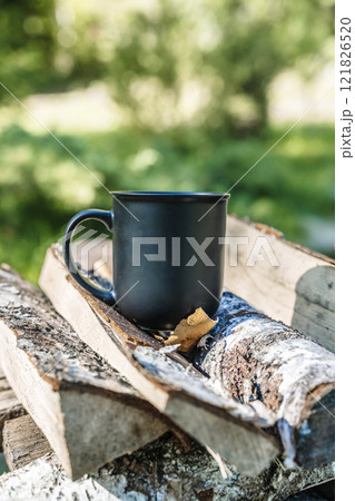 Cup of hot drink in nature outdoor camp Cup of hot drink in nature outdoor camp 121826520