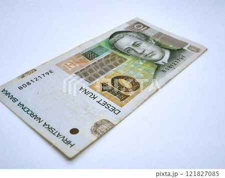 National Croatian money currency, 10 Kuna banknote on a white background. The concept of changing the currency in Croatia into euro National Croatian money currency, 10 Kuna banknote on a white background. The concept of changing the currency in Croatia into euro 121827085