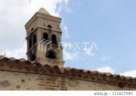 Historic Stone Chimney on Tiled Roof Historic Stone Chimney on Tiled Roof 121827540