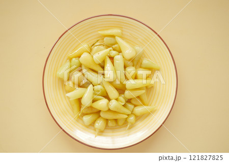 Top View of Pickled Vegetables in a Yellow Ceramic Bowl on Table Top View of Pickled Vegetables in a Yellow Ceramic Bowl on Table 121827825