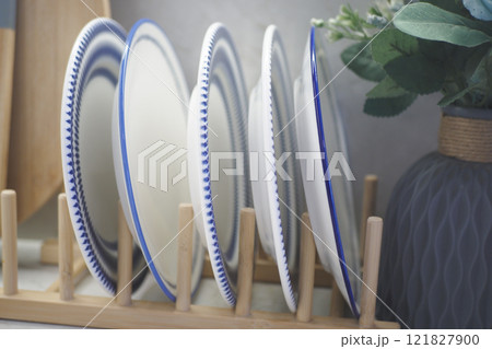 round bowl or ceramic plate on kitchen table. round bowl or ceramic plate on kitchen table. 121827900