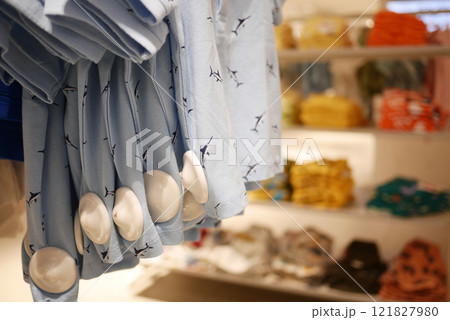 Clothing security tag on a shirt , Clothing security tag on a shirt , 121827980