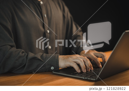 Man using a laptop with social media, typing live chat chatting on application communication digital website and social network concept. Social media application chat box. 121828922