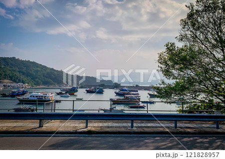 Walking path, boats, mountain, tree, sky, cloud in countryside Walking path, boats, mountain, tree, sky, cloud in countryside 121828957