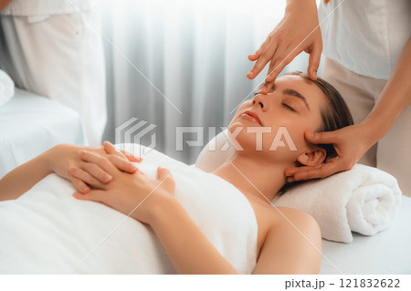Caucasian woman enjoying relaxing anti-stress head massage. Quiescent Caucasian woman enjoying relaxing anti-stress head massage. Quiescent 121832622
