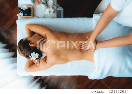 Caucasian woman customer enjoying relaxing anti-stress massage. Quiescent 121832634