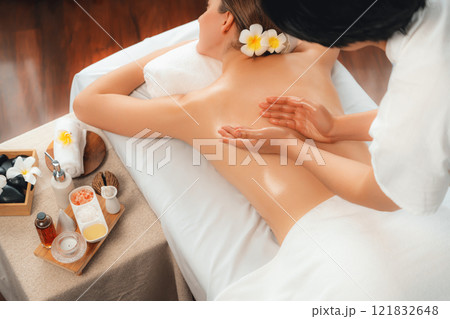 Caucasian woman customer enjoying relaxing anti-stress massage. Quiescent 121832648
