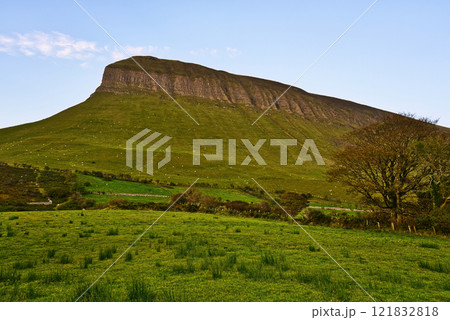 Benbulbin mountain in Sligo Ireland - Majestic Green Mountain Featuring a Stunning View Under a Benbulbin mountain in Sligo Ireland - Majestic Green Mountain Featuring a Stunning View Under a 121832818