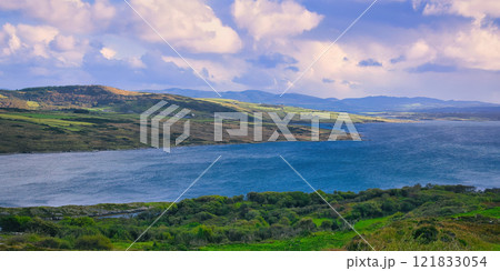 Donegal - A Picturesque Coastal Landscape featuring Calming Waters and Vibrant Lush Greenery all 121833054