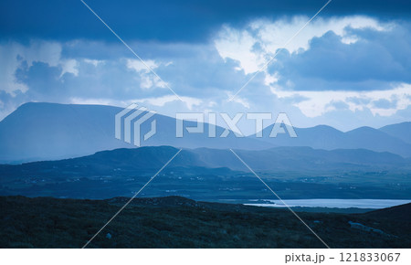 The Misty Mountains are beautifully framed under dramatic and captivating clouds overhead 121833067
