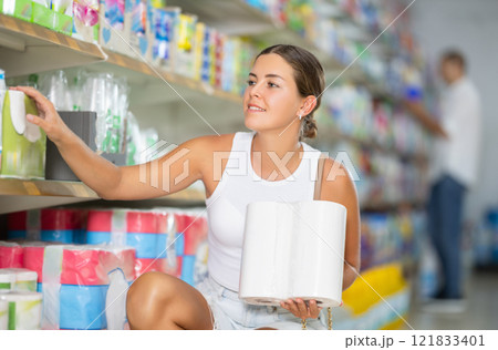 Young woman choosing paper towels in store Young woman choosing paper towels in store 121833401