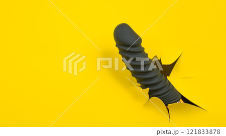 Black sex toy sticking out of yellow paper background. Copy space. Black sex toy sticking out of yellow paper background. Copy space. 121833878