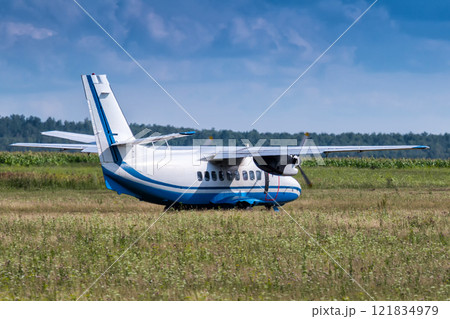 Turboprop passenger airplane at a rural airfield is preparing to take off Turboprop passenger airplane at a rural airfield is preparing to take off 121834979