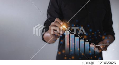 Young man with smartphone mobile hand hold a pen touching to visualize money growth Young man with smartphone mobile hand hold a pen touching to visualize money growth 121835023