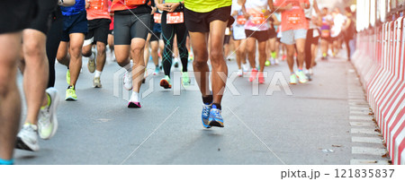 Marathon Running In The Light Of Morning, People Running On City Road Detail On Legs, Step, Walk And Outdoor Exercise Activities Concept. Marathon Running In The Light Of Morning, People Running On City Road Detail On Legs, Step, Walk And Outdoor Exercise Activities Concept. 121835837
