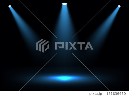 Dramatic blue spotlights converge on a dark stage creating a bold focal point for product displays, performances, or creative lighting projects. Dramatic blue spotlights converge on a dark stage creating a bold focal point for product displays, performances, or creative lighting projects. 121836450