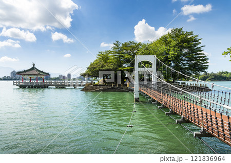View of the suspension bridge leading to Fu Guo Island at Chenghcing Lake Scenic Area in Kaohsiung, Taiwan. 121836964