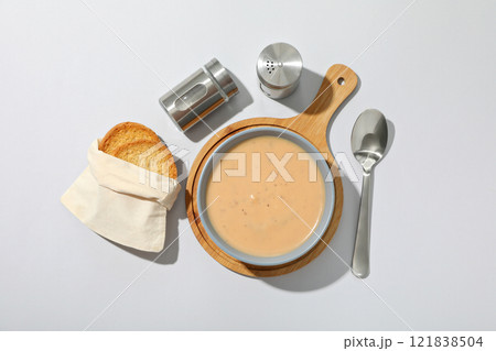 A bowl of cream of mushroom soup with croutons 121838504