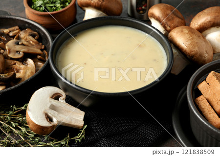 A bowl of mushroom cream soup on a dark background 121838509