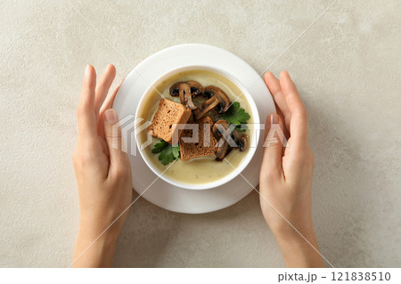 A bowl of cream of mushroom soup with croutons 121838510