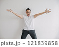 Young excited Asian man with eyeglasses with open arms. 121839858