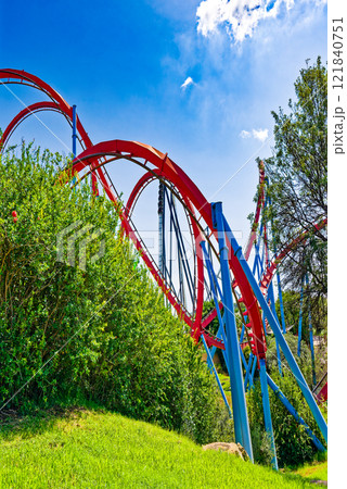 Roller Coaster in funny amusement park. Roller Coaster in funny amusement park. 121840751