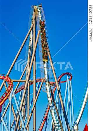 Roller Coaster in funny amusement park. Roller Coaster in funny amusement park. 121840788