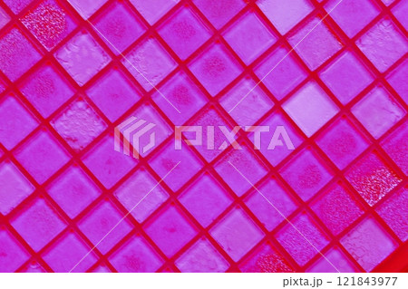 Close-up of a reflected glass facade with a rectangular grid system.  121843977