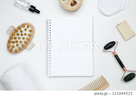 Eco-friendly beauty products: massage brush, loofah, marble roller, towel, reusable cotton pads, mock up white notebook, sustainable self-care concept Eco-friendly beauty products: massage brush, loofah, marble roller, towel, reusable cotton pads, mock up white notebook, sustainable self-care concept 121844525