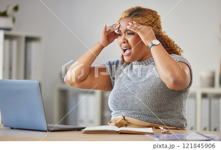 Frustrated, angry, annoyed business woman reading emails on a laptop in a modern office. Young professional worker stressed about a mistake, upset about broken internet connection or pc Frustrated, angry, annoyed business woman reading emails on a laptop in a modern office. Young professional worker stressed about a mistake, upset about broken internet connection or pc 121845906