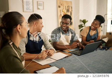 A group of clothing style and fashion designers working together as a team, taking notes and doing research on a laptop. An excited, positive and trendy bunch of professionals collaborating. A group of clothing style and fashion designers working together as a team, taking notes and doing research on a laptop. An excited, positive and trendy bunch of professionals collaborating. 121845976
