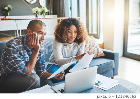 Finance, budget and banking with a young couple feeling stress, anxiety and worry about savings, investment and the future. Boyfriend and girlfriend planning and talking about bills, taxes and debt Finance, budget and banking with a young couple feeling stress, anxiety and worry about savings, investment and the future. Boyfriend and girlfriend planning and talking about bills, taxes and debt 121846362