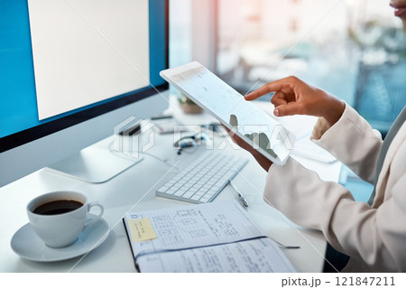 Professional business woman holding a tablet, doing research and looking for new ideas for a project online on the internet in an office at work. Employee typing, scrolling and searching on the web 121847211