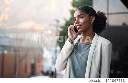 Talking on a phone, communication and networking with a young, confident and ambitious young business woman on a balcony. Professional and creative designer on a call for work discussion and planning Talking on a phone, communication and networking with a young, confident and ambitious young business woman on a balcony. Professional and creative designer on a call for work discussion and planning 121847318