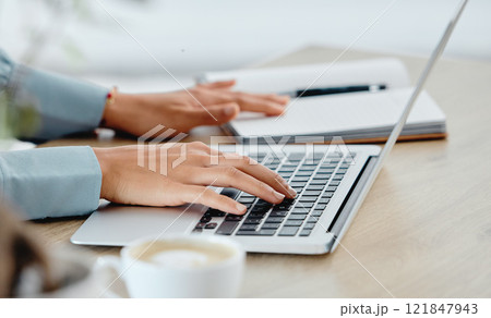 Social media creative typing on laptop, reading book and planning marketing plan while working on company strategy idea. Closeup hands of ambitious agent scrolling, searching or posting on technology 121847943