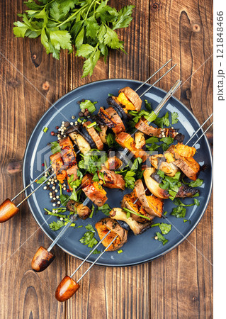 Tasty cooked sweet potato on skewers. Tasty cooked sweet potato on skewers. 121848466