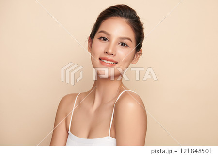 Beautiful young asian woman with clean fresh skin on beige background, Face care, Facial treatment, Cosmetology, beauty and spa, Asian women portrait. Beautiful young asian woman with clean fresh skin on beige background, Face care, Facial treatment, Cosmetology, beauty and spa, Asian women portrait. 121848501