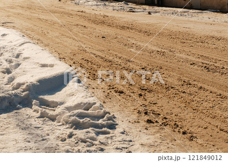uncleaned roads after a winter snowfall in Kazakhstan. highway covered with sticky snow in Shymkent 121849012