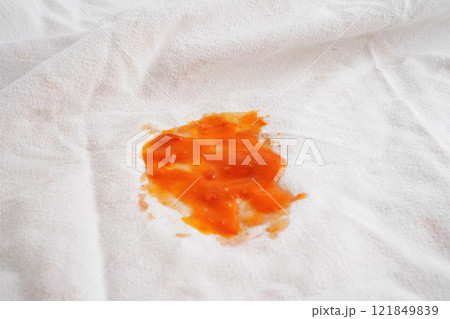 Dirty tomato sauce stain or ketchup on cloth to wash with washing powder, cleaning housework. 121849839