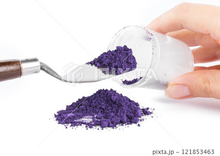 Vibrant Purple Pigment Spills From a Glass Container on a Clean Surface, violet Vibrant Purple Pigment Spills From a Glass Container on a Clean Surface, violet 121853463