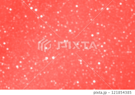 Glittering coral pink background with sparkling highlights and blurred shimmering effect 121854385